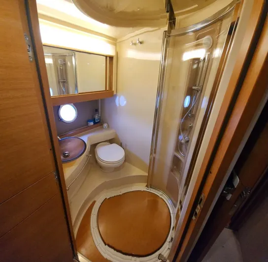 River Rat Yacht Photos Pics Luxurious bathroom in 2013 Azimut 45 Flybridge yacht with shower and porthole.