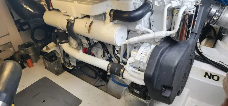 River Rat Yacht Photos Pics Engine room of 2013 Azimut 45 Flybridge yacht, showcasing mechanical components and layout.