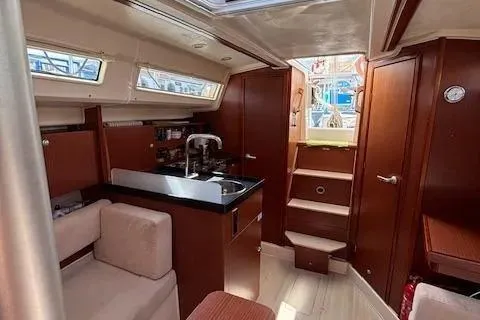  Yacht Photos Pics Interior of 2016 Hanse 315 sailboat with modern kitchen and seating area.