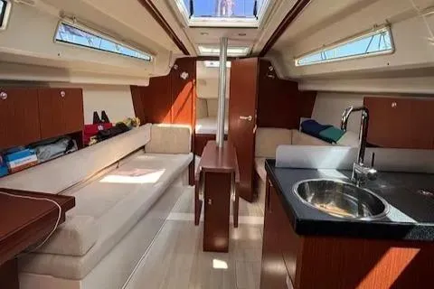  Yacht Photos Pics Interior of 2016 Hanse 315 sailboat with modern design and cozy seating area.