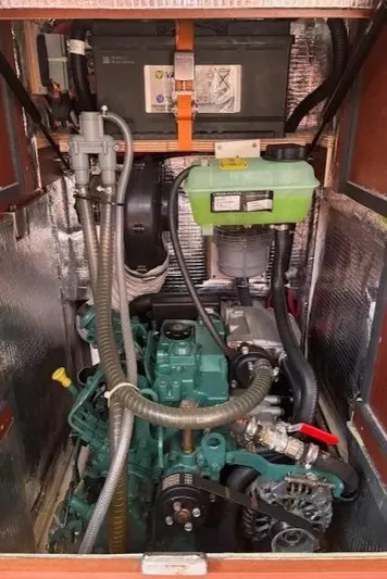  Yacht Photos Pics Engine compartment of a 2016 Hanse 315 sailboat, featuring a green marine engine.