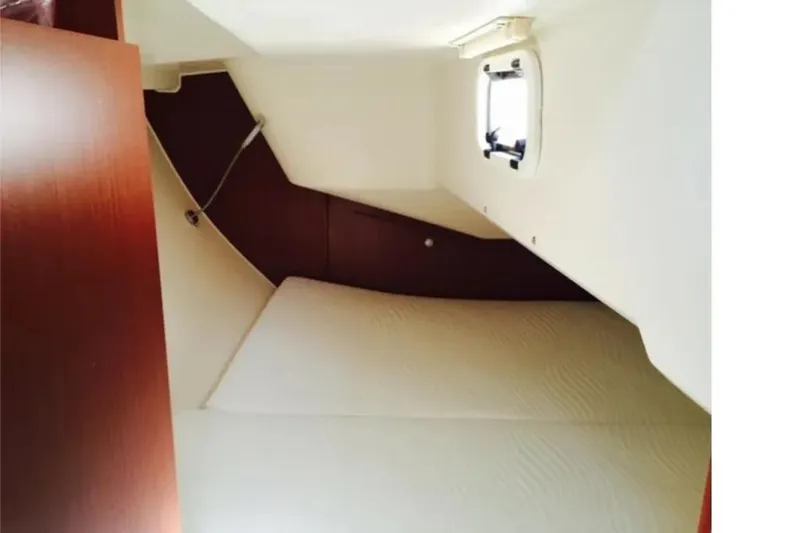  Yacht Photos Pics Interior cabin of 2016 Hanse 315 yacht, featuring a cozy sleeping area.