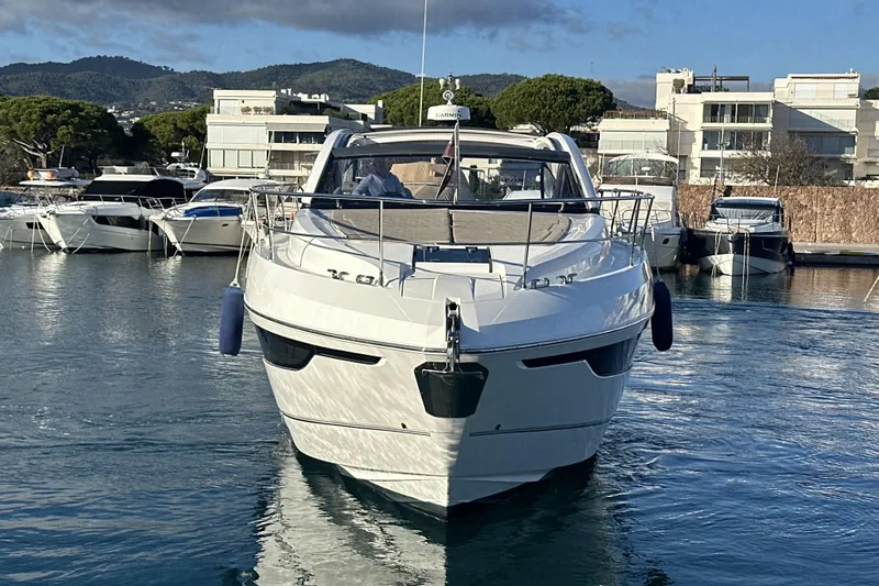  Yacht Photos Pics 2021 Fairline Targa 45 Open yacht docked in a marina, surrounded by other boats.