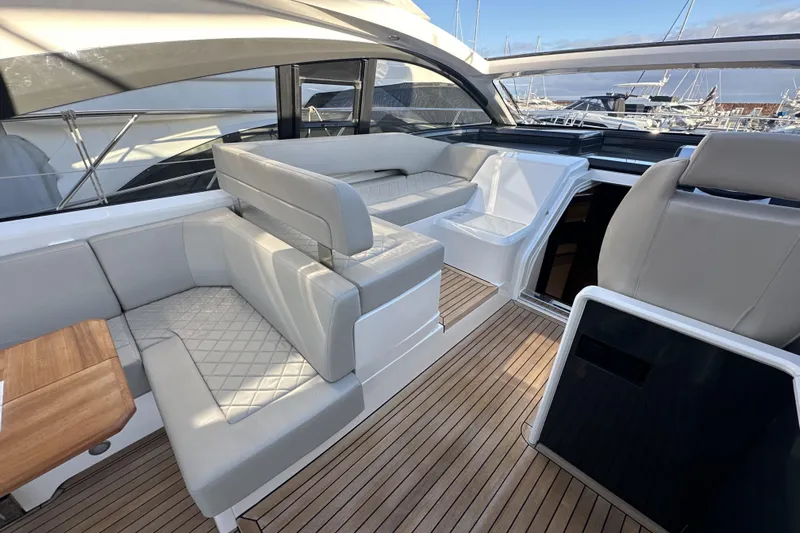  Yacht Photos Pics Luxurious 2021 Fairline Targa 45 Open yacht interior with elegant seating and wooden flooring.