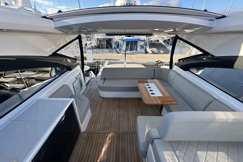  Yacht Photos Pics 2021 Fairline Targa 45 Open yacht interior with sleek seating and wooden table.
