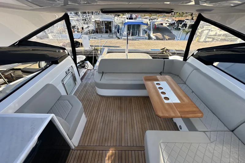  Yacht Photos Pics Luxurious interior of 2021 Fairline Targa 45 Open yacht with elegant seating and wooden table.