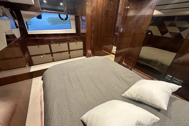  Yacht Photos Pics Luxurious cabin interior of 2021 Fairline Targa 45 Open yacht with elegant wood finishes.