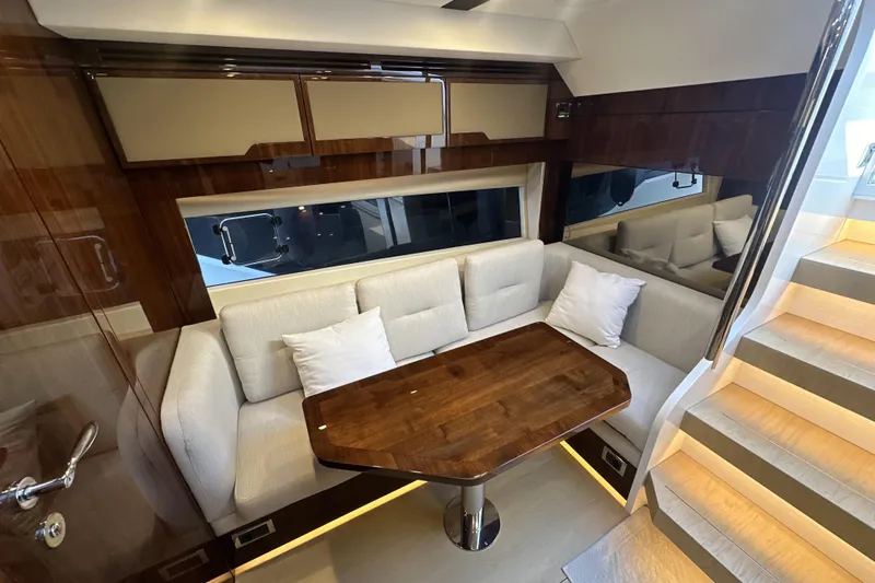  Yacht Photos Pics Luxurious interior of 2021 Fairline Targa 45 Open yacht with elegant seating and wooden table.