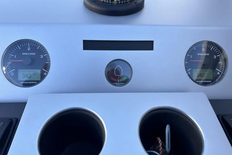 Yacht Photos Pics Dashboard of 2021 Fairline Targa 45 Open with RPM gauges and cup holders.