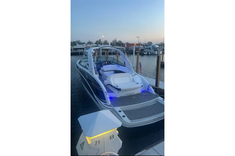  Yacht Photos Pics 2015 Formula 290 Sun Sport boat docked at marina during sunset.