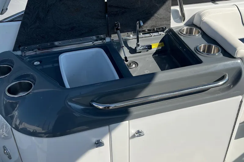  Yacht Photos Pics 2015 Formula 290 Sun Sport boat sink and cup holders on deck.