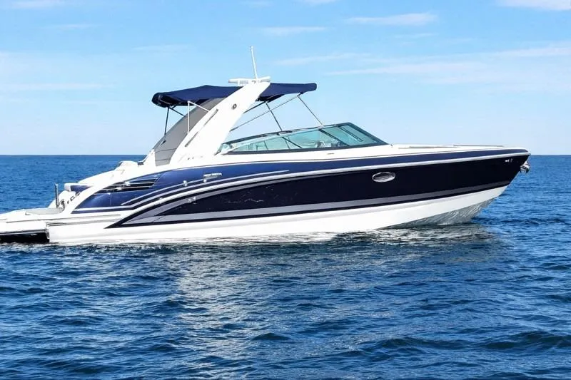  Yacht Photos Pics 2015 Formula 290 Sun Sport boat cruising on open water.