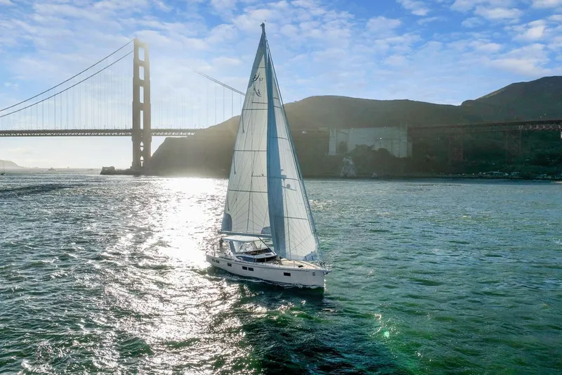 No Retreat Yacht Photos Pics Sailboat Hylas H57 (2020) cruising near Golden Gate Bridge under blue sky.