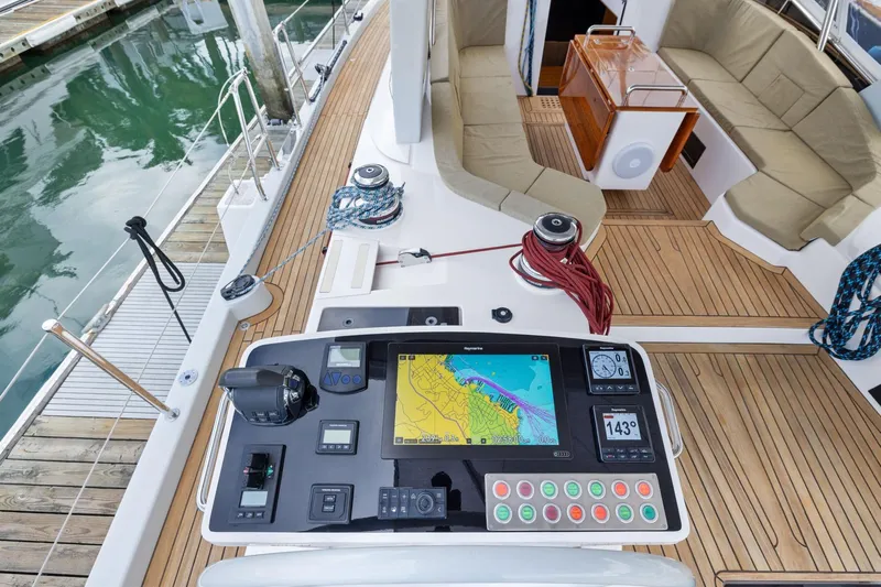 No Retreat Yacht Photos Pics Cockpit of 2020 Hylas H57 yacht with navigation controls and seating area.