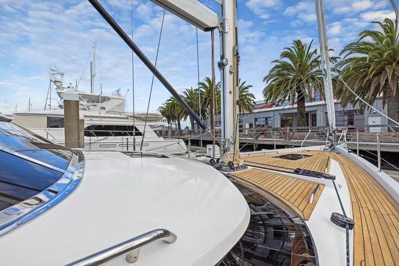 No Retreat Yacht Photos Pics Luxury Hylas H57 yacht docked at marina with palm trees, 2020 model.