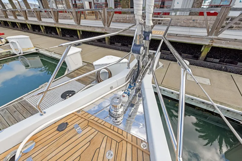 No Retreat Yacht Photos Pics 2020 Hylas H57 yacht deck with polished fittings and wooden flooring at a marina.