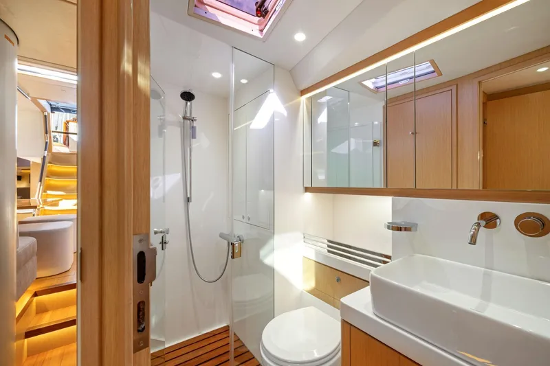 No Retreat Yacht Photos Pics Luxurious bathroom interior of 2020 Hylas H57 yacht with modern fixtures and wooden accents.