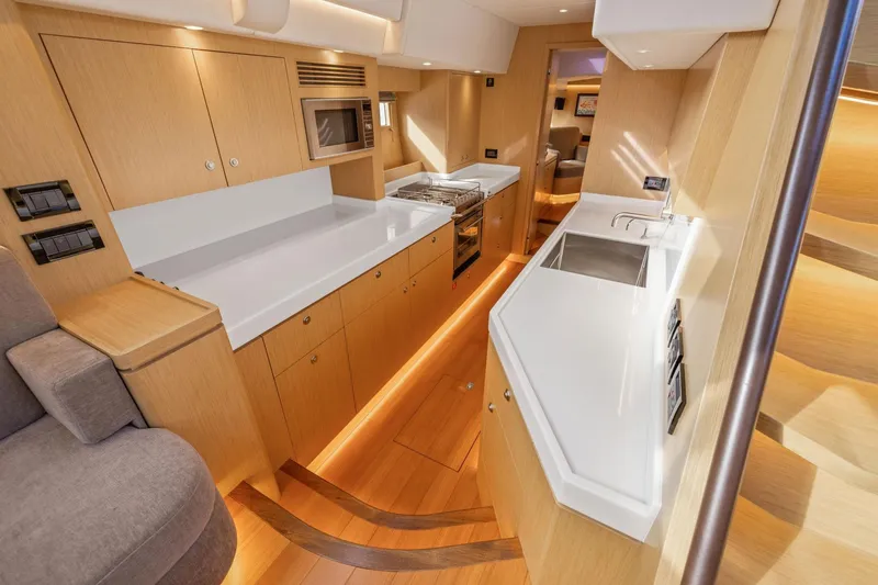 No Retreat Yacht Photos Pics Luxurious interior of 2020 Hylas H57 yacht featuring modern kitchen design.