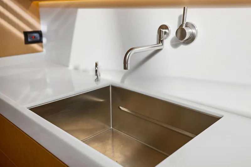 No Retreat Yacht Photos Pics Modern stainless steel sink with sleek faucet in Hylas H57 yacht, 2020 model.