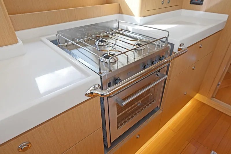 No Retreat Yacht Photos Pics Modern kitchen in 2020 Hylas H57 yacht with sleek stove and oven.