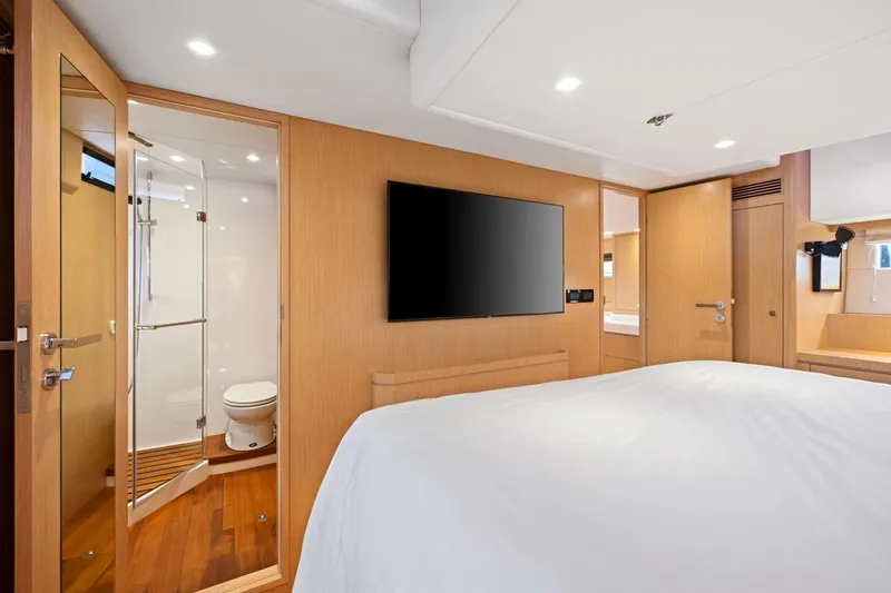 No Retreat Yacht Photos Pics Luxurious interior of 2020 Hylas H57 yacht featuring bedroom and ensuite bathroom.