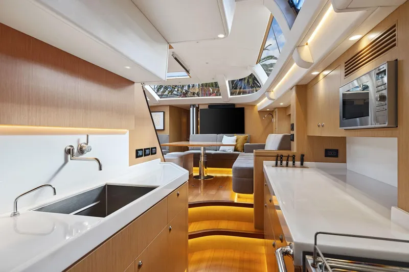 No Retreat Yacht Photos Pics Luxurious interior of 2020 Hylas H57 yacht with modern kitchen and seating area.