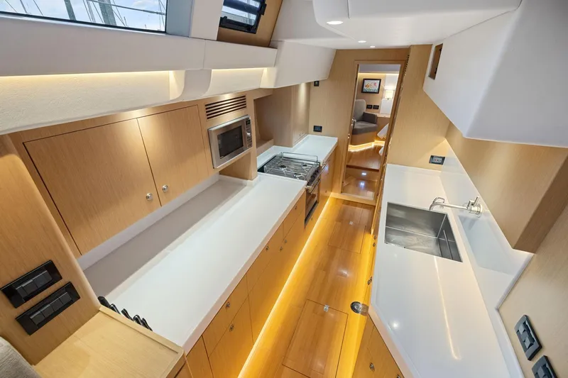 No Retreat Yacht Photos Pics Luxurious interior of 2020 Hylas H57 yacht featuring modern kitchen design.