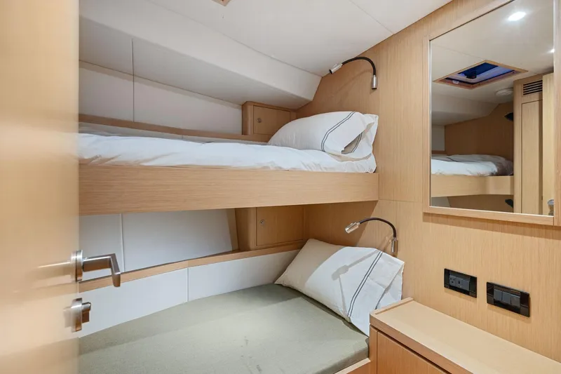 No Retreat Yacht Photos Pics 2020 Hylas H57 yacht cabin with bunk beds and modern wooden interior.