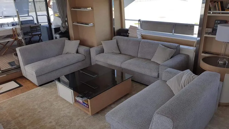  Yacht Photos Pics Luxurious interior of 2013 Benetti Delfino 93 yacht with modern grey sofas and glass coffee table.