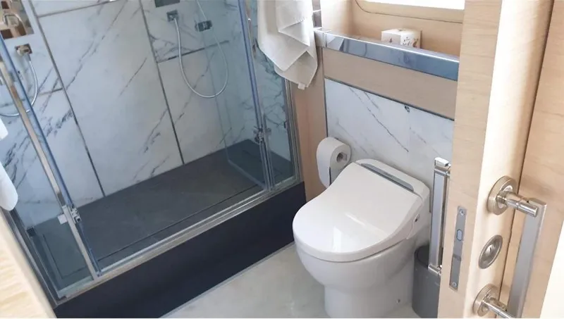  Yacht Photos Pics Luxury bathroom on a 2013 Benetti Delfino 93 yacht with modern shower and toilet.