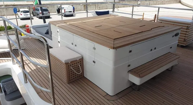  Yacht Photos Pics Benetti Delfino 93 2013 yacht deck with hot tub and seating area.