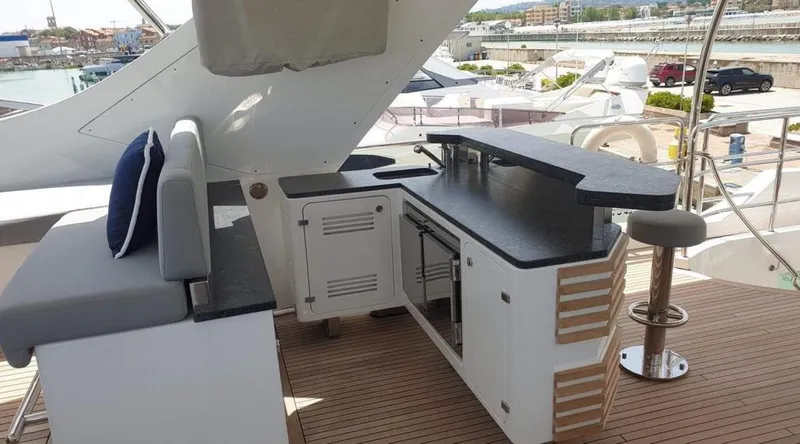  Yacht Photos Pics Outdoor bar and seating area on a 2013 Benetti Delfino 93 yacht.