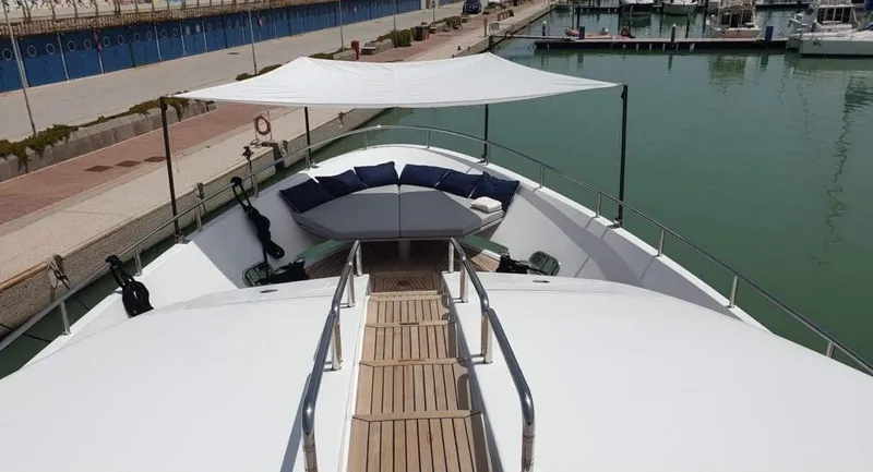  Yacht Photos Pics Benetti Delfino 93 yacht 2013 model, docked with shaded seating area on deck.