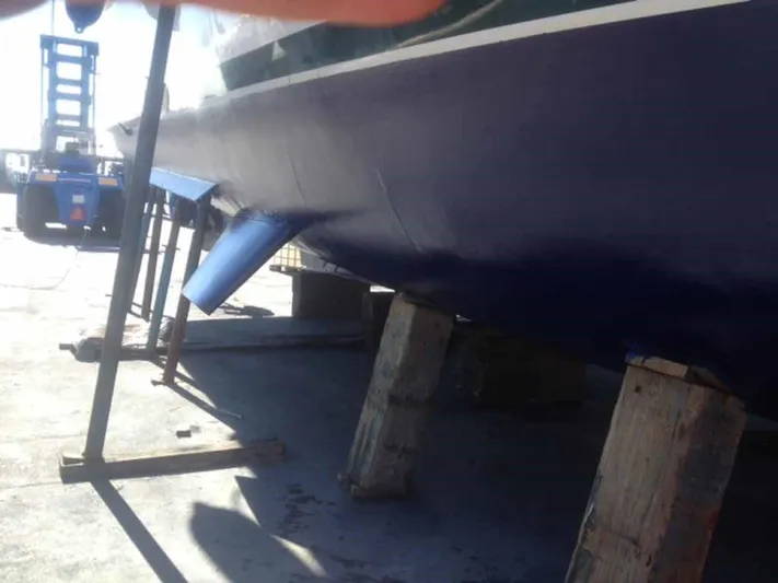  Yacht Photos Pics Boat on wooden supports, ABD 60 model, 2006, with forklift in background.