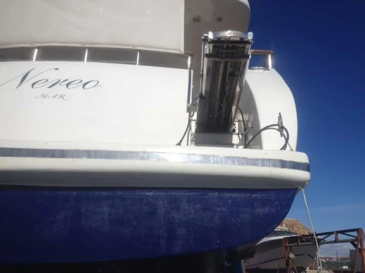  Yacht Photos Pics Rear view of 2006 ABD 60 yacht with blue hull and visible equipment.