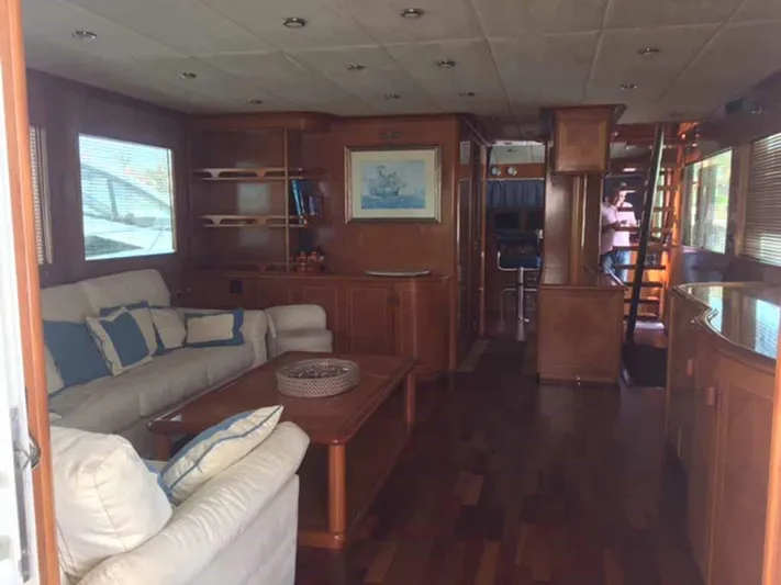  Yacht Photos Pics Luxurious yacht interior with wooden decor, plush seating, and elegant furnishings, ABD 60, 2006 model.