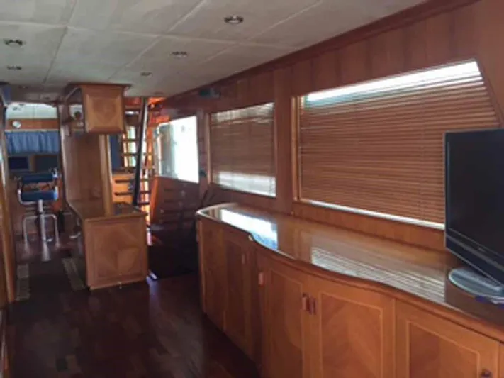  Yacht Photos Pics Luxurious interior of 2006 ABD 60 yacht with wooden finishes and modern amenities.