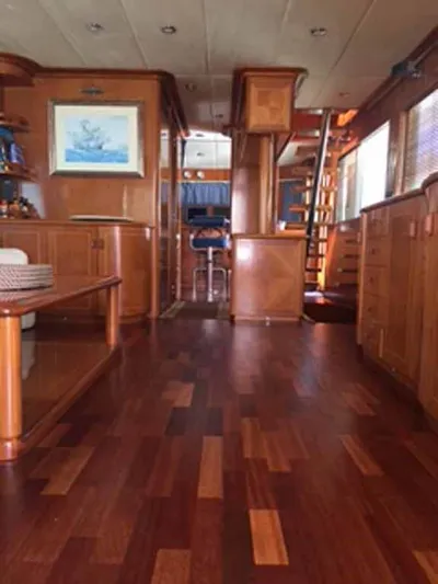  Yacht Photos Pics Luxurious wooden interior of 2006 ABD 60 yacht with elegant furnishings and decor.
