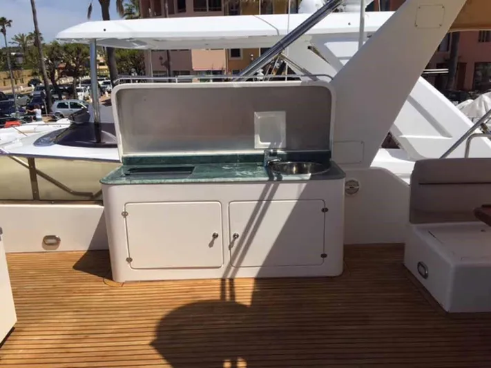  Yacht Photos Pics Outdoor yacht kitchenette with sink on ABD 60, 2006 model, featuring wooden deck.