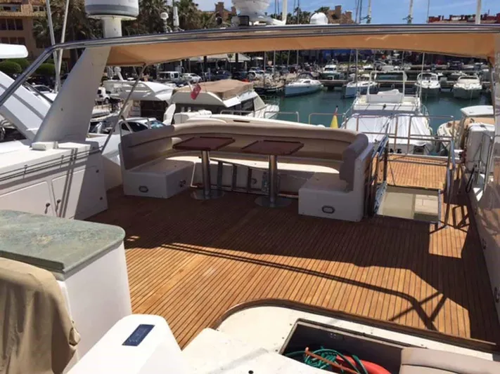  Yacht Photos Pics Luxurious ABD 60 yacht deck with seating, docked at marina, 2006 model.