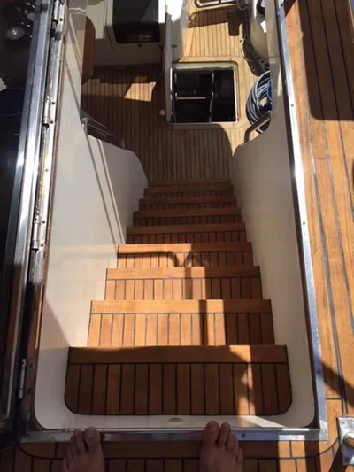  Yacht Photos Pics Wooden stairs on a 2006 ABD 60 yacht, leading to lower deck.