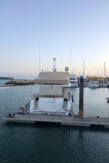  Yacht Photos Pics Luxury yacht ABD 60, 2006 model, docked at marina during sunset.