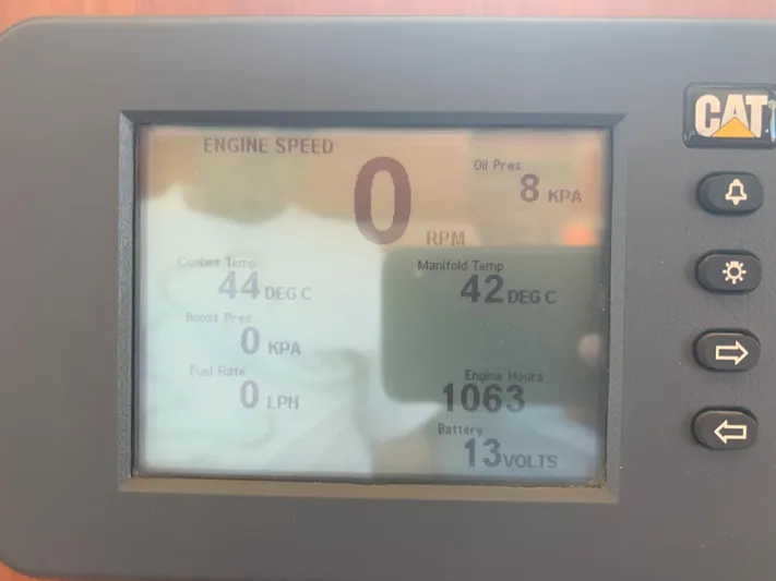  Yacht Photos Pics Engine monitor display showing RPM, oil pressure, coolant and manifold temperature, engine hours, and battery voltage.