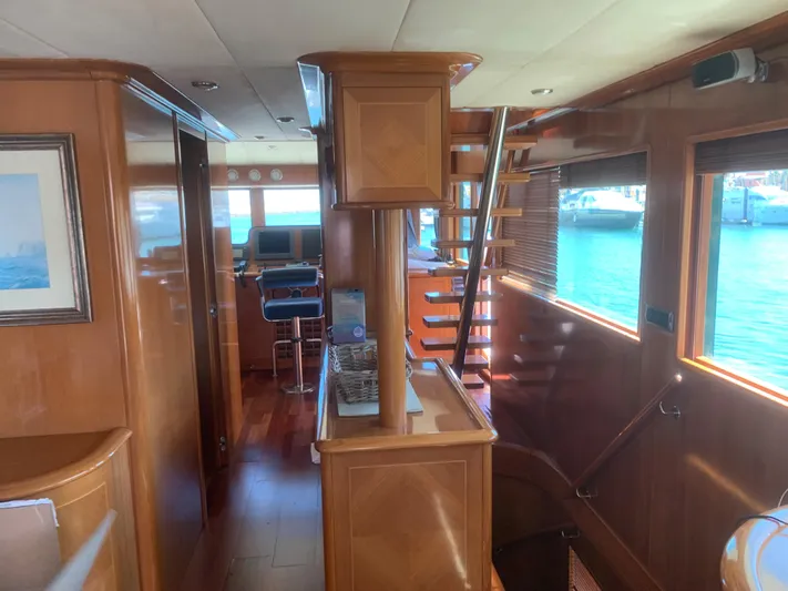  Yacht Photos Pics Luxurious interior of 2006 ABD 60 yacht with wooden finishes and modern amenities.