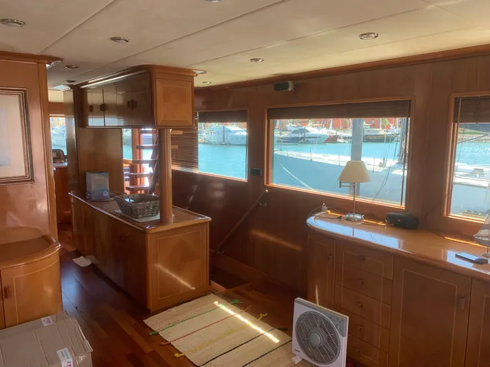 Yacht Photos Pics Luxurious interior of 2006 ABD 60 yacht with wooden furnishings and large windows.