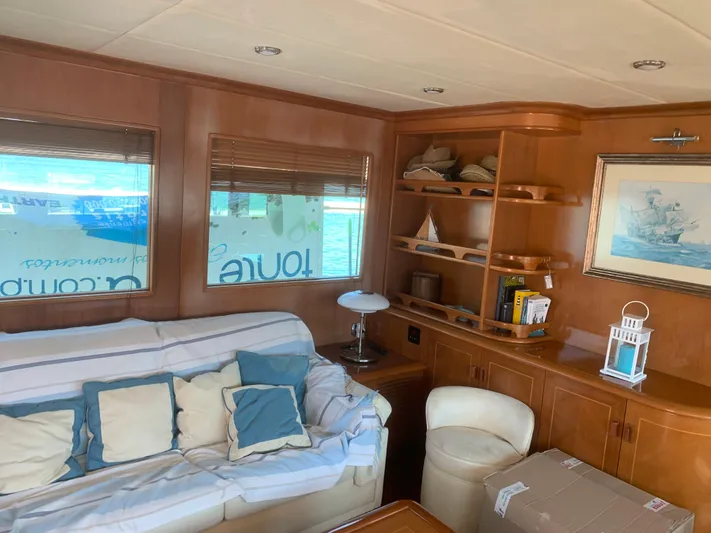  Yacht Photos Pics Luxurious yacht interior with wooden decor, cozy seating, and nautical-themed accents, ABD 60, 2006.