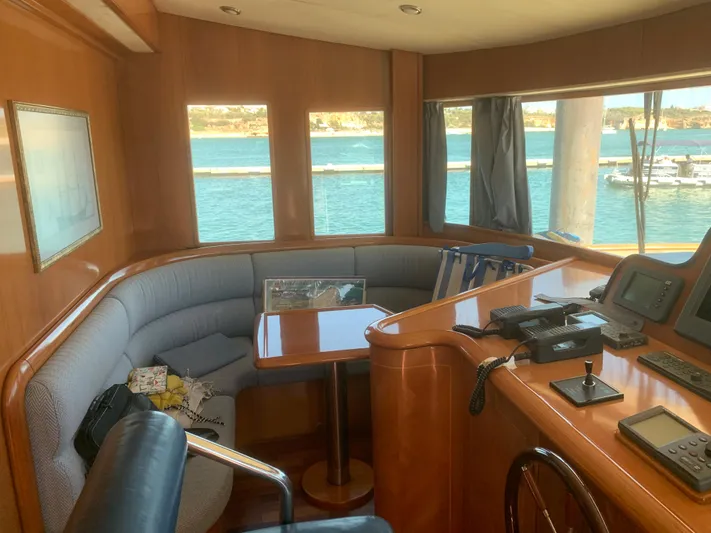  Yacht Photos Pics Luxurious interior of a 2006 ABD 60 yacht with ocean view and navigation equipment.