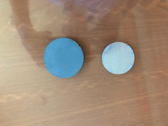  Yacht Photos Pics Two round metal discs on a wooden surface, ABD model 60, 2006.