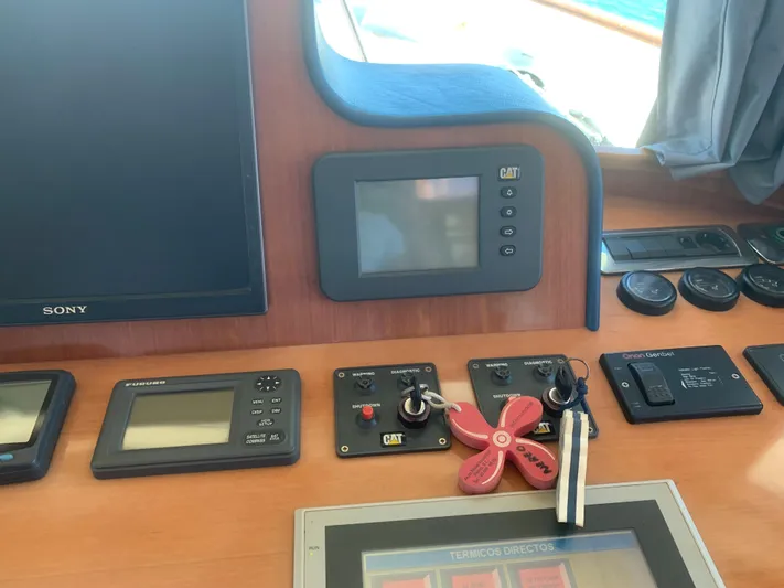  Yacht Photos Pics Control panel of ABD 60 yacht, 2006 model, featuring navigation and monitoring equipment.