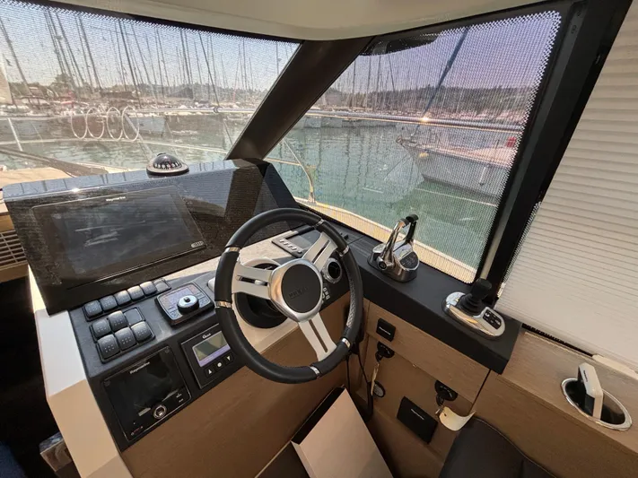  Yacht Photos Pics Helm of 2020 Jeanneau Prestige 420 Flybridge yacht with modern navigation equipment.